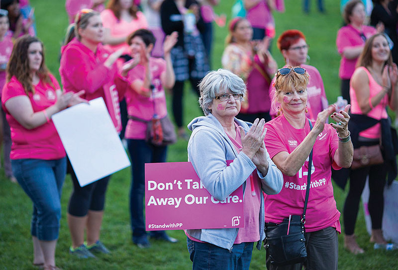 Helen Kamin left and Cathy Vaughan Grabowski have been supporters of Planned Parenthood since the early 70's. The Pink Out rally was held at Founders Green in Stapleton Sept. 29