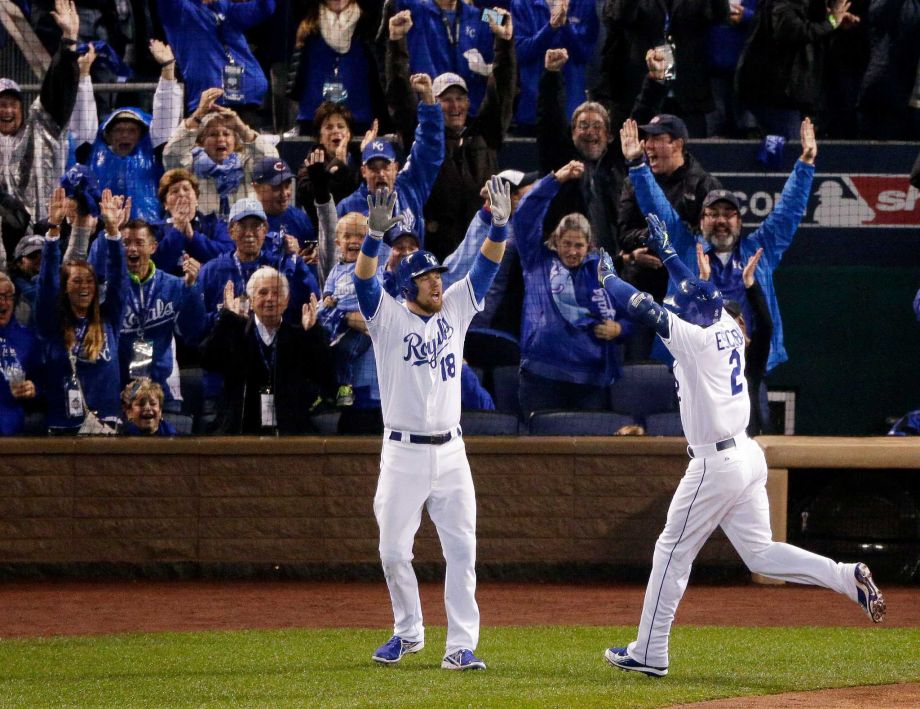 Kansas City Royals Alcides Escobar right celebrates his on a inside-the-park home run with Ben Zobrist during the first inning of Game 1 of the Major League Baseball World Series against the New York Mets Tuesday Oct. 27 2015 in Kansas City Mo. Pho