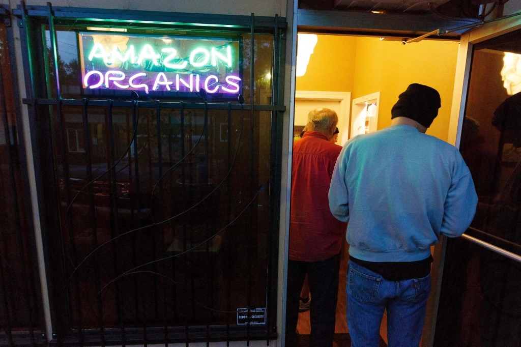 Customers wait in line early in the morning at Amazon Organics a pot dispensary in Eugene Ore. to purchase recreational marijuana on Thursday Oct. 1 2015