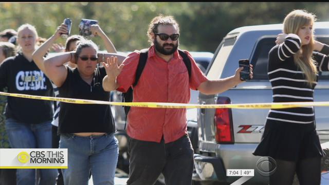 Oregon college shaken by massacre reopens with counselors, comfort dogs