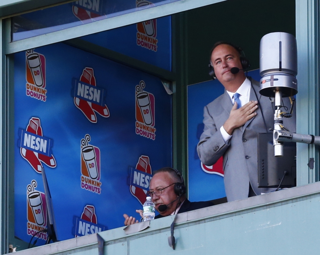 Boston Red Sox broadcaster Don Orsillo acknowledges the crowd during the eighth inning of a game between the Red Sox and Orioles Sunday at Fenway Park