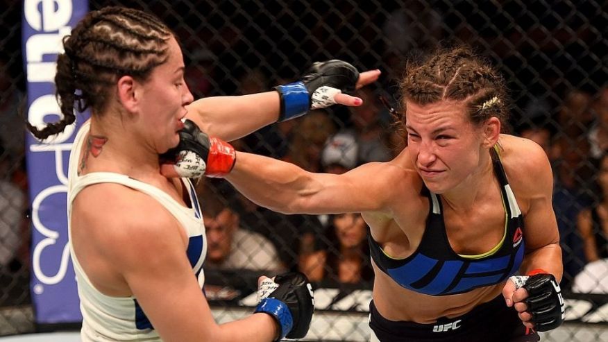 CHICAGO IL- JULY 25  Miesha Tate punches Jessica Eye in their women's bantamweight bout during the UFC event at the United Center