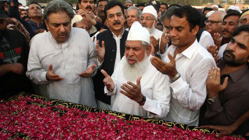 Pakistan’s former Prime Minister Yousuf Raza Gilani prays for his nephew who died in the Hajj stampede in September