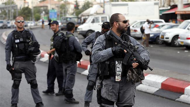 Israeli forces stand guard in the area where a Palestinian was killed in the old city of East al-Quds