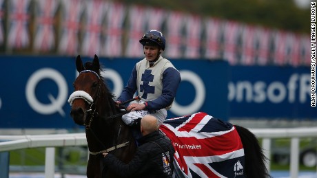 Pat Smullen riding Fascinating Rock win The Qipco Champion Stakes at Ascot racecourse