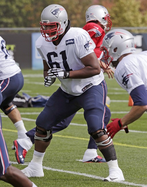 New England Patriots left guard Marcus Cannon blocks for quarter back Tom Brady during an NFL football practice in Foxborough Mass. Wednesday Oct. 14 2015. Cannon could get more playing time due to the injury to starting left guard Nate Solder