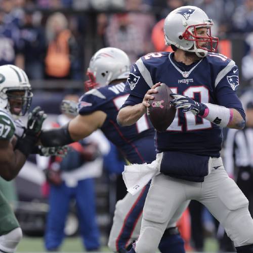 Patriots quarterback Tom Brady sets to pass during the second half of an NFL football game Sunday Oct. 25 2015 in Foxborough Mass