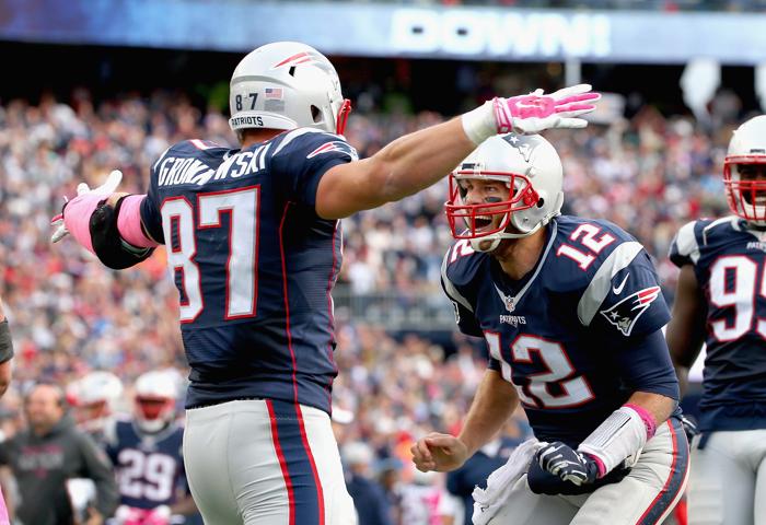 FOXBORO MA- OCTOBER 25 Tom Brady #12 and Rob Gronkowski #87 of the New England Patriots react after Gronkowski scored a touchdown during the fourth quarter against the New York Jets at Gillette Stadium