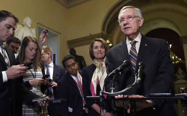 House Democratic Leader Nancy Pelosi of Calif. second from right listens as Senate Minority Leader Harry Reid of Nev. right talks to reporters on Capitol Hill in Washington Wednesday Oct. 28 2015 about the passage of a budget by the House. (AP Pho