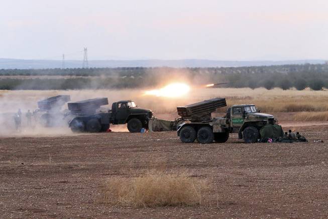 Oct. 7 2015 Syrian army rocket launchers fire near the village of Morek in Syria. The Syrian army has launched an offensive this week in central and northwestern Syria aided by Russian airstrikes. (AP