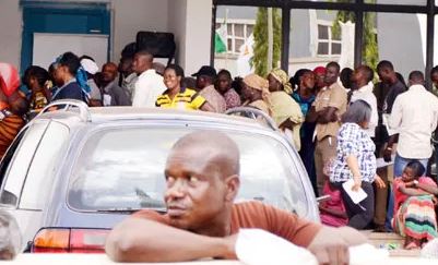 People queuing outside a bank to do BVN registeration before deadline