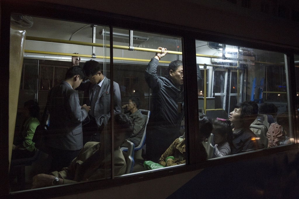 People ride on public transit in Pyongyang on Oct