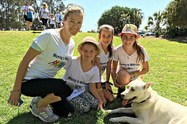 STEPPING UP Community Focus chairwoman Jody Tunnicliffe finishes the fun run with Gaebl Doyle 9 Amy Miller 12 Leita Rose Doyle 12 and Snowy the dog