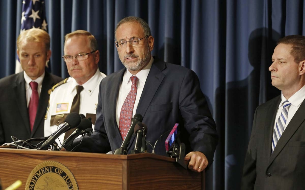 U.S. Attorney Andrew Luger center addresses a press conference Thursday Oct. 29 2015 in Minneapolis where federal charges stemming from a long-term child exploitation investigation were announced against Daniel Heinrich