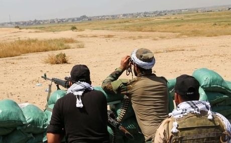 Peshmerga forces and volunteers hold a position south of Kirkuk. AFP file