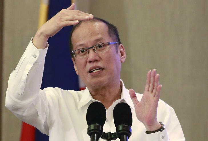 President Benigno Aquino gestures while answering questions during a Foreign Correspondent Association of the Philippines annual presidential forum in Manila