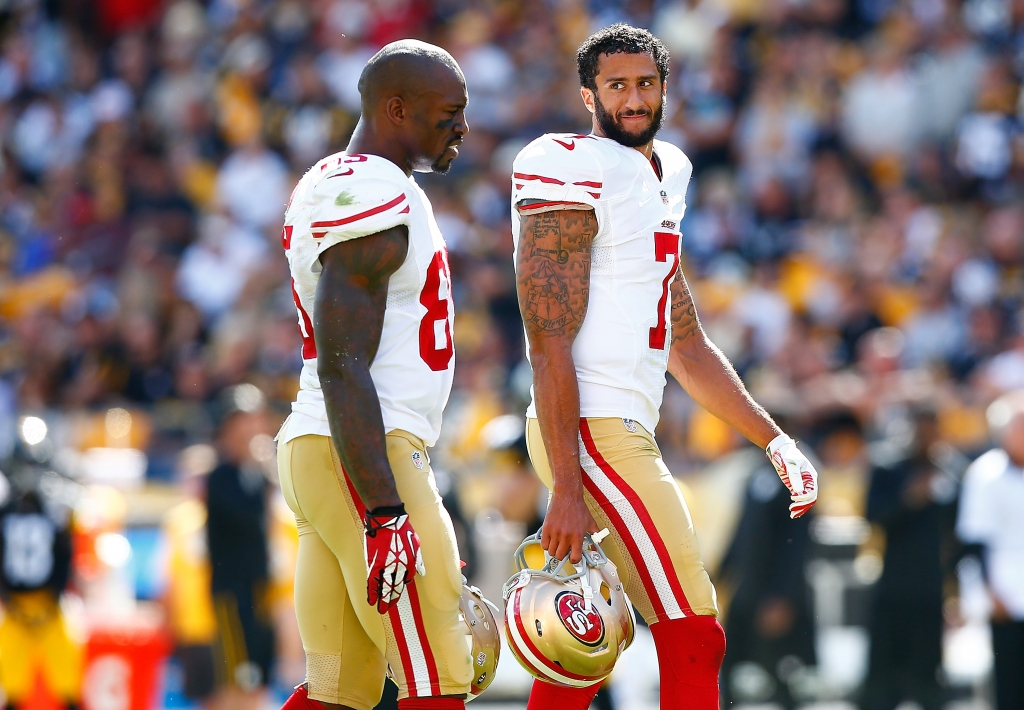 PITTSBURGH PA- SEPTEMBER 20 Colin Kaepernick #7 and Vernon Davis #85 of the San Francisco 49ers talk during a timeout against the Pittsburgh Steelers during the game at Heinz Field