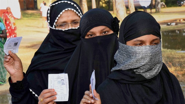 Voters wait in queues to cast their vote during second phase of Bihar elections at Gaya Mohanpur on Friday