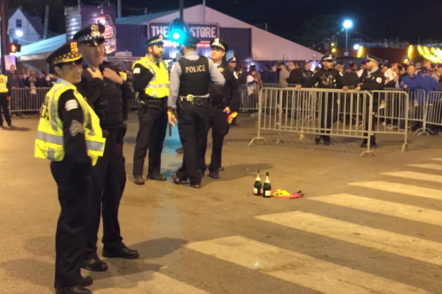 Police keep an eye on crowds in Wrigleyville after the Cubs clinched the NLDS at Wrigley Field