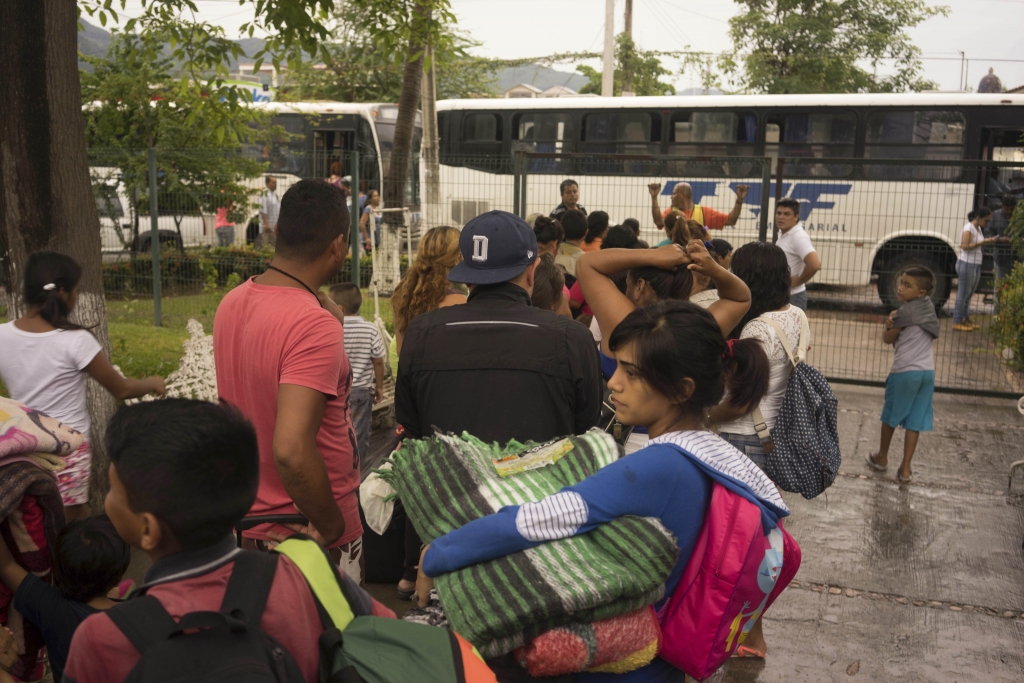 People seeking safety from Hurricane Patricia stand in line to be taken to another shelter because the one they had just arrived at was full in the Pacific resort city Puerto Vallarta Mexico Friday Oct. 23 2015. Patricia barreled toward southwestern