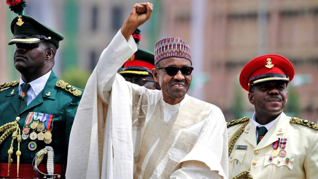 Nigerian President Muhammadu Buhari salutes his supporters during his Inauguration in Abuja Nigeria