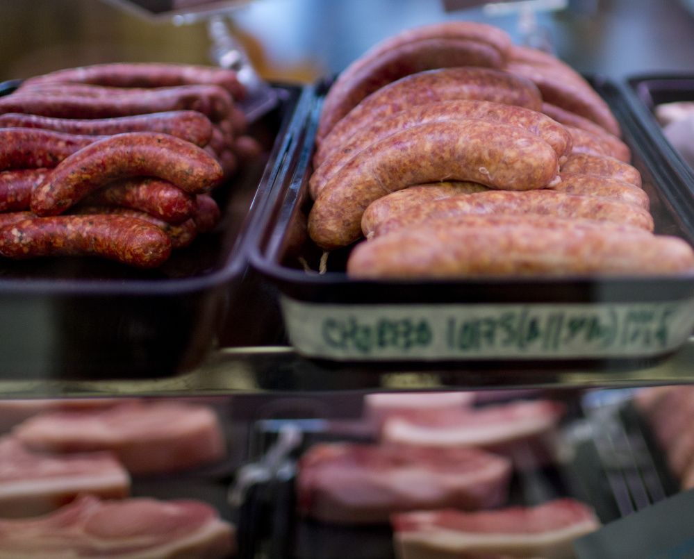 Chorizo and other sausages are on display in the butcher’s case at The Farm Stand in South Portland on Tuesday – tasty ingredients in a heated debate over a report that condemned processed meats