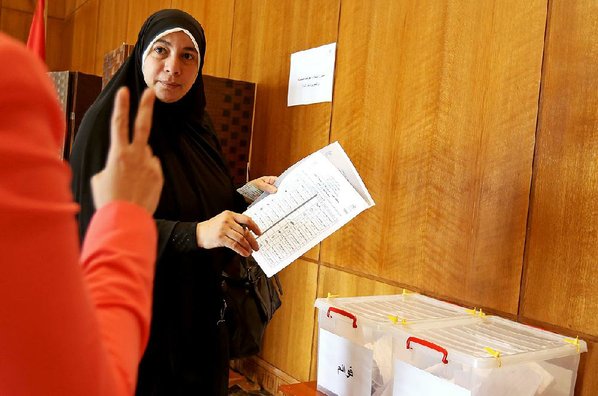 RAAD ADAYLEH							Credit AP				An Egyptian who lives in Jordan casts her vote Saturday in Amman as part of Egypt’s parliamentary elections