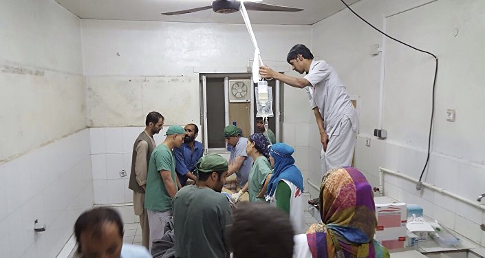 Afghan surgeons work inside a Medecins Sans Frontieres hospital after an air strike in the city of Kunduz Afghanistan in this