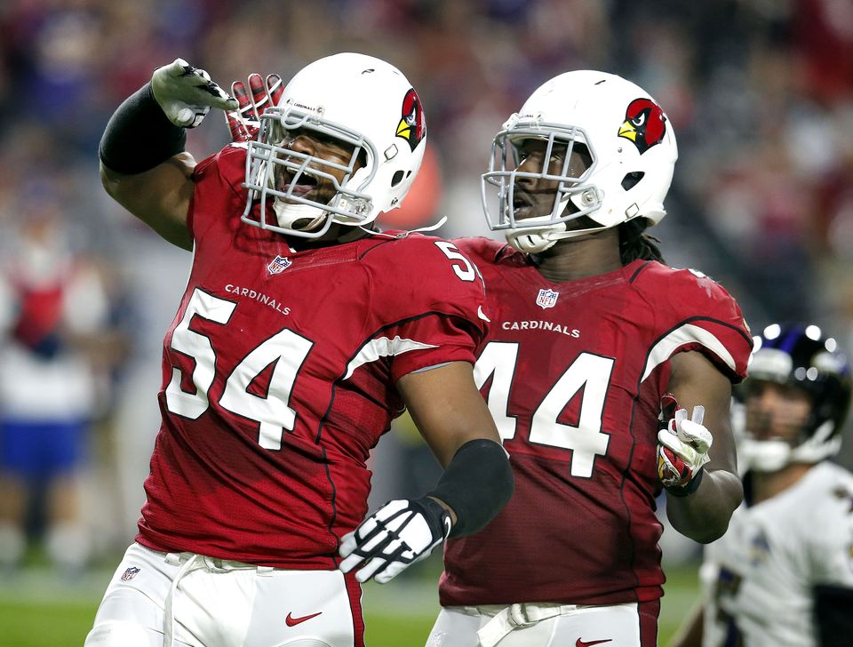 Johnson rolls over defender Cardinals beat Ravens 26-18