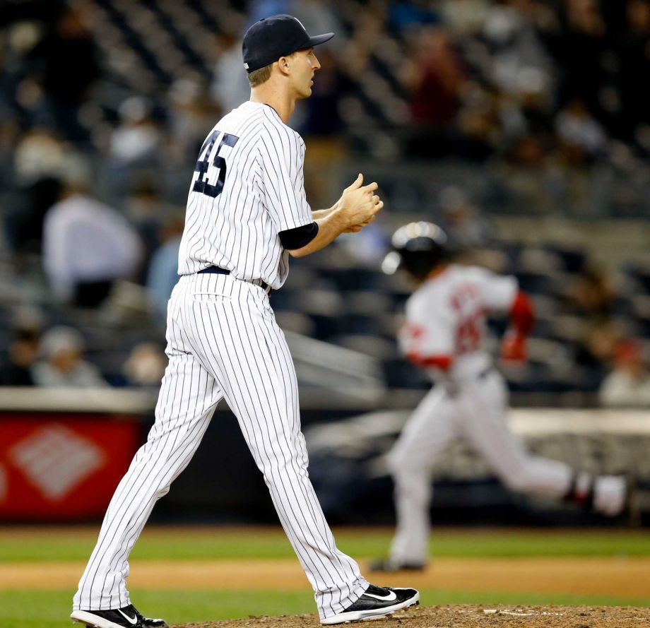 New York Yankees relief pitcher Chasen Shreve looks to the outfield as Boston Red Sox Mookie Betts runs the bases after hitting an 11th inning two-run home run in a baseball game against the New York Yankees in New York Wednesday Sept. 30 2015