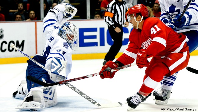 Toronto Maple Leafs goalie James Reimer stops a Detroit Red Wings center Luke Glendening shot in the second period of an NHL hockey game in Detroit Friday Oct. 9 2015