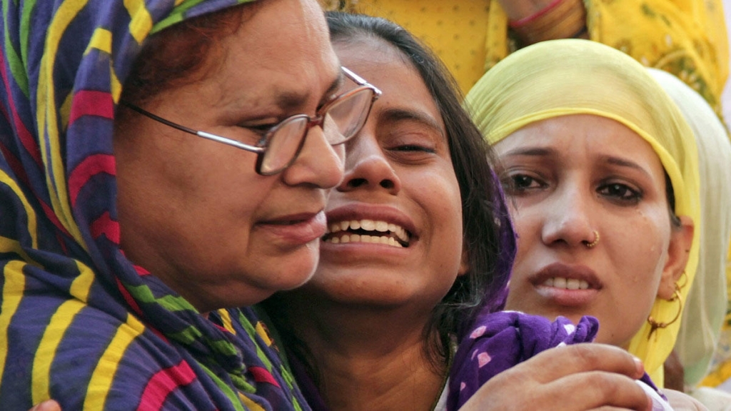 Relatives of Mohammad Akhlaq mourn after he was killed by a mob over rumors that he butchered a cow