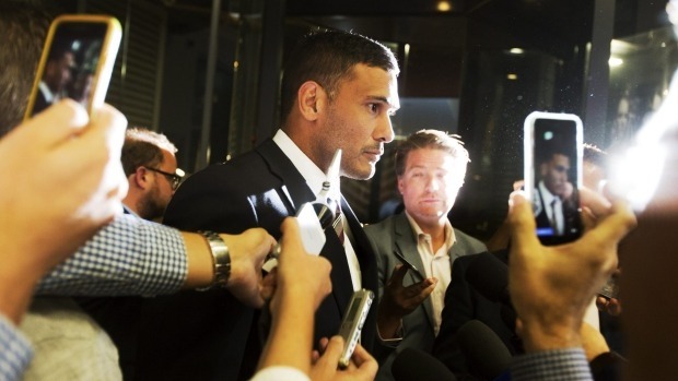 Relieved Brisbane captain Justin Hodges leaves the NRL judiciary on Tuesday night after being cleared of a lifting tackle