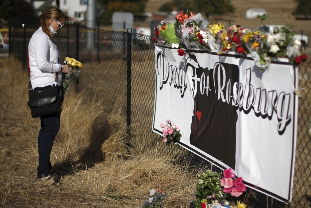 ReutersLeanne DiLorenzo 48 leaves flowers at a memorial outside Umpqua Community College in Roseburg Oregon United States