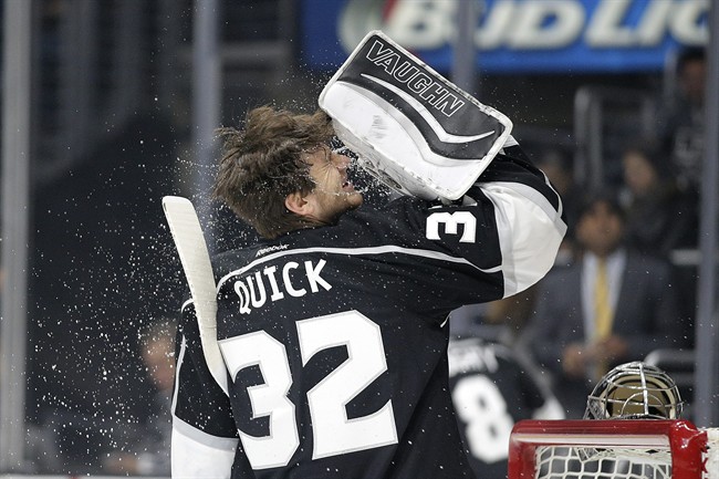 Los Angeles Kings goalie Jonathan Quick sprays water on his face before an NHL hockey game against the San Jose Sharks Wednesday Oct. 7 2015 in Los Angeles