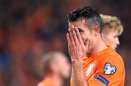 Robin van Persie feels the pain during Holland's defeat by the Czech Republic