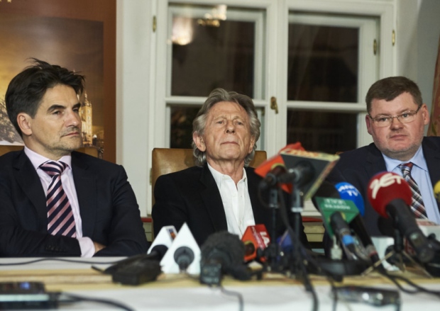 Roman Polanski centre with his lawyers faces the press at the Bonarowski Palace Hotel in Krakow Poland