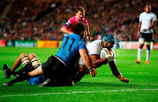 Tevita Cavubati of Fiji beats the Uruguay defence to score their fifth try during the 2015 Rugby World Cup Pool A match between Fiji and Uruguay at Stadium MK