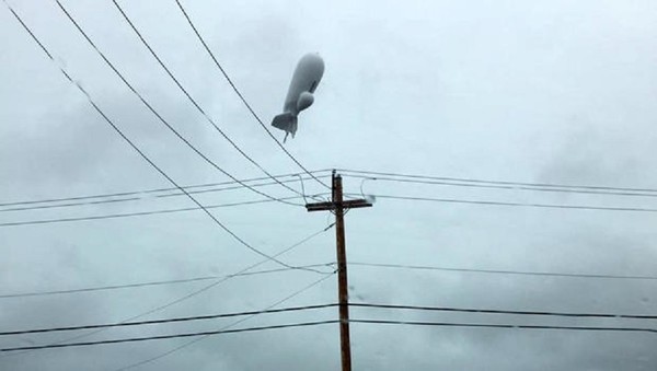 A runaway blimp caused havoc dragging its mile-long tether line along the ground as it flew over Pennsylvania today. That line took out power to about 30,000 customers. It also took out a traffic light pulled up a guardrail and broke a pole