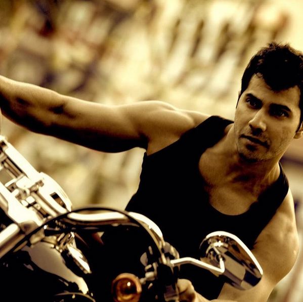 After Shah Rukh Khan Varun Dhawan becomes the man riding a mean machine courtesy Rohit Shetty