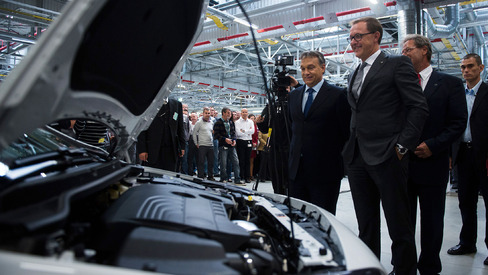 Viktor Orban Hungary's prime minister left and Thomas Sedran interim chief executive of General Motors Co.'s Opel unit second left during the opening of the company's new engine assembly plant in Szentgotthard Hungary on Sept. 20 2012