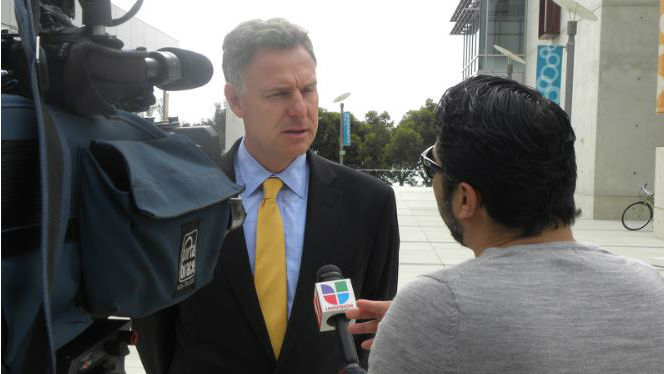 Scott Peters interviewed by a television reporter