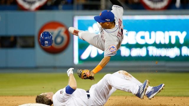 Ruben Tejada of the NY Mets is hit by a slide by Chase Utley of the LA Dodgers