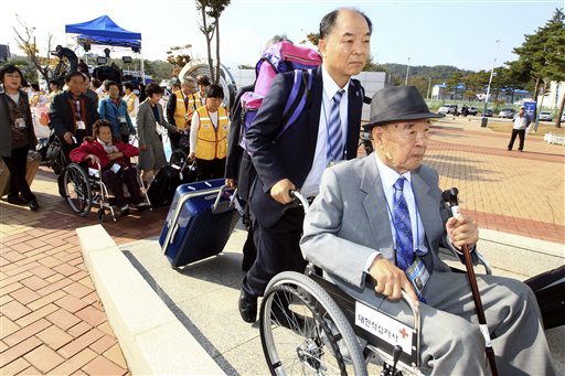 South Korean elderly people leave for North Korea to take part in family reunions with their North Korean family members at Inter Korean transit office in Goseong South Korea Saturday Oct. 24 2015. Hundreds of South Koreans have crossed the border