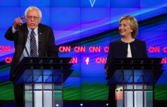 Sen. Bernie Sanders of Vermont left speaks as Hillary Rodham Clinton looks on during the CNN Democratic presidential debate