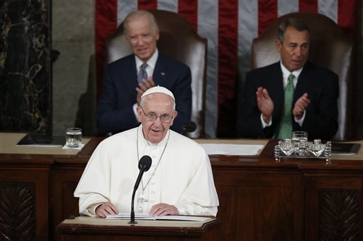 Pope Francis addresses a joint meeting of Congress on Capitol Hill in Washington Thursday Sept. 24 2015 making history as the first pontiff to do so. Listening behind the pope are Vice President Joe Biden and House Speaker John Boehner of Ohio. (AP Ph