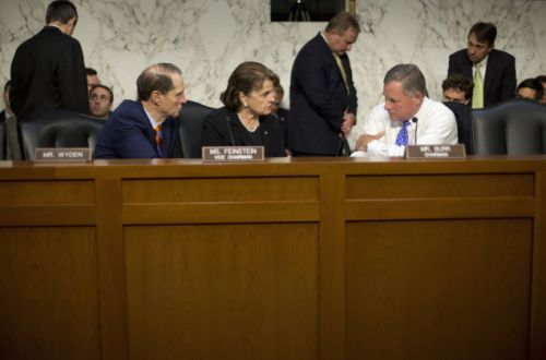 Senate Intelligence Committee Chairman Sen. Richard Burr R-N.C. right confers with committee Vice-Chair. Sen. Dianne Feinstein D-Calif. center and committee member Sen. Ron Wyden D-Ore. on Capitol Hill