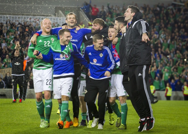 Republic of Ireland's Shane Long celebrates with teammate Robbie Keane at the final whistle of the UEFA European Championship Qualifying match at the Aviva Stadium Dublin. PRESS ASSOCIATION