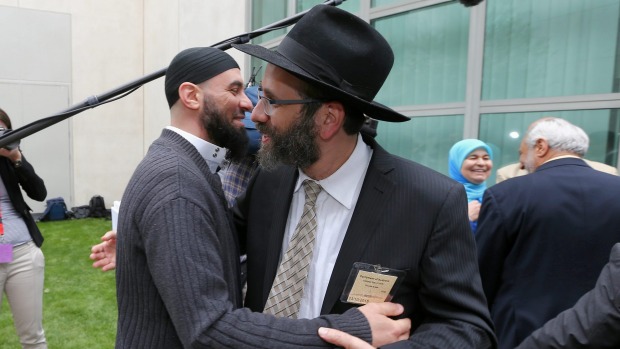 Sheikh Wesam Charkawi and Rabbi Zalman Kastel greet each other at the event