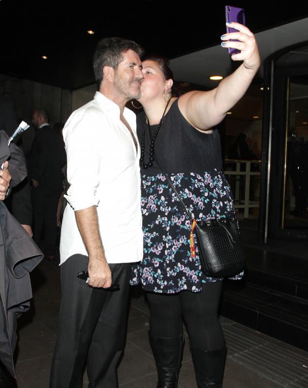 Simon Cowell had a queue of female fans lining up to kiss him outside the Pride of Britain Awards